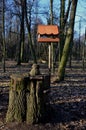 Seasonal bird feeder with made of right roof tiles made of burnt clay.