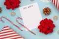 Seasonal Christmas holiday flat lay with concept for children letter to Santa Clause with white empty letter, pine cones