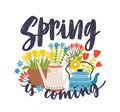 Seasonal composition with Spring Is Coming lettering written with cursive calligraphic font, blooming springtime flowers