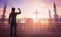 International human rights day concept: Silhouette of man raised hands Religious freedom Royalty Free Stock Photo