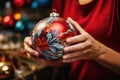 Seasonal decor preparing : woman crafting Christmas balls