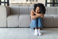 Seasonal Depression. Upset Young Black Woman Sitting On Floor At Home Royalty Free Stock Photo