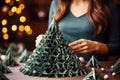Seasonal DIY delight: woman\'s green paper tree design