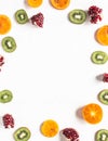 Seasonal healthy natural fruit frame with persimmon, kiwi, pomegranate slices