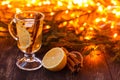 Seasonal and holidays concept. Christmas and autumn theme. One glasses mulled wine on a rustic wooden table. Selective focus