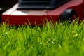 Seasonal maintenance works in garden, lawn movers in action, green grass cutting, lawn care, English lawn Royalty Free Stock Photo