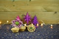 Christmas food photography picture with traditional food of mince pies with English winter flower and fairy lights in background