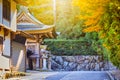 Seasonal Red Maples in Front of The Monastery Gates on Sacred Mount Koyasan in Japan