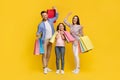 Seasonal Sales. Portrait Of Happy Caucasian Family Holding Bright Shopping Bags Royalty Free Stock Photo