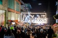 Shoppers pass under the illuminated Christmas street decorations in Birmingham