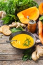 Seasonal spicy fall autumn creamy pumpkin and carrot soup Royalty Free Stock Photo