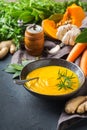 Seasonal spicy fall autumn creamy pumpkin and carrot soup Royalty Free Stock Photo