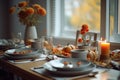 Seasonal table setting with pumpkins and flowers