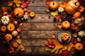 A seasonal table setting for Thanksgiving Day, showcasing pumpkins, autumn leaves, and decorative elements arranged on a wooden Royalty Free Stock Photo