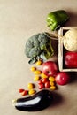 Seasonal vegetables in wicker basket. Sweet pepper greens eggplant turnip avocado. portrait format