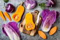 Seasonal winter autumn fall vegetables over gray stone table. Plant based vegan or vegetarian cooking concept. Clean eating food