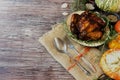 Seasonal wooden table setting with small pumpkins Royalty Free Stock Photo