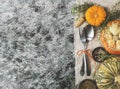 Seasonal wooden table setting with small pumpkins Royalty Free Stock Photo