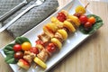 BBQ grilled chicken vegetable kebab skewers ready to eat served on a plate Royalty Free Stock Photo