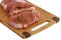 Seasoned fillet medallions on bamboo cutting board