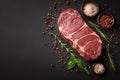 Seasoned perfection Fresh raw striploin steak with salt and herbs