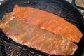 Raw Seasoned Ribs Cooking on the Grill Royalty Free Stock Photo