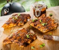 Seasoned ribs on a picnic table at a BBQ Royalty Free Stock Photo