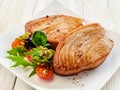 Seasoned Tuna Steaks on Plate with Fresh Salad Royalty Free Stock Photo