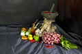 Seasoning concept. Thai herb ingredient, Fresh culinary herbs and spices on black fabric background with a pestle and mortar Royalty Free Stock Photo