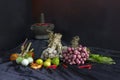 Seasoning concept. Thai herb ingredient, Fresh culinary herbs and spices on black fabric background with a pestle and mortar Royalty Free Stock Photo