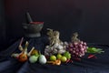 Seasoning concept. Thai herb ingredient, Fresh culinary herbs and spices on black fabric background with a pestle and mortar Royalty Free Stock Photo