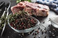 Seasoning four kinds of pepper peas in bowl with raw meat and herbs