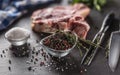 Seasoning four kinds of pepper peas in bowl with raw meat and herbs