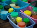 SEASONING PLASTIC BOTTLES IN PLASTIC BASKETS