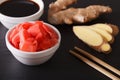 Seasoning for sushi: Soy sauce and pickled ginger close-up. horizontal Royalty Free Stock Photo