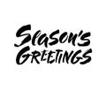 Seasons greetings calligraphy lettering text on white background with vintage paper texture. Retro greeting card for Christmas and Royalty Free Stock Photo