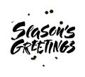 Seasons greetings calligraphy lettering text on white background with vintage paper texture. Retro greeting card for Christmas and Royalty Free Stock Photo