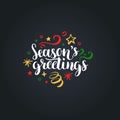 Seasons Greetings lettering on black background. Vector hand drawn Christmas illustration. Happy Holidays greeting card. Royalty Free Stock Photo