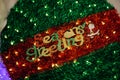 Seasons Greetings Text decorated on green red Christmas decoration tree ball Royalty Free Stock Photo