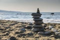 sea stones against the backdrop of the beach in the form of a stone tower, summer vacation 3 Royalty Free Stock Photo