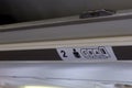 Seat number on luggage shelf inside the passenger airplan