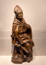 `Seated Bishop`, a limewood with grey-black stain German statue, circa 1500, on display in the Cloisters in New York City.