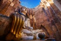 Seated Buddha image at Wat Si Chum temple in Sukhothai Historical Park in Thailand