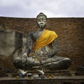 Seated buddha with a saffron sash