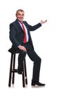 Seated business man presenting Royalty Free Stock Photo