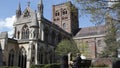 Seated couple enjoy view of St Albans Abbey in park