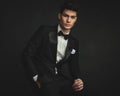 seated gentleman wearing black tuxedo leaning forward Royalty Free Stock Photo