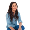 Seated happy young casual woman in jeans clothes