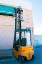 Seated narrow aisle stacker for transporting pallets on concrete surfaces. Hoisting-and-transport warehouse equipment. Lifting