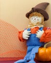 Seated Scarecrow Holding Its Britches Royalty Free Stock Photo
